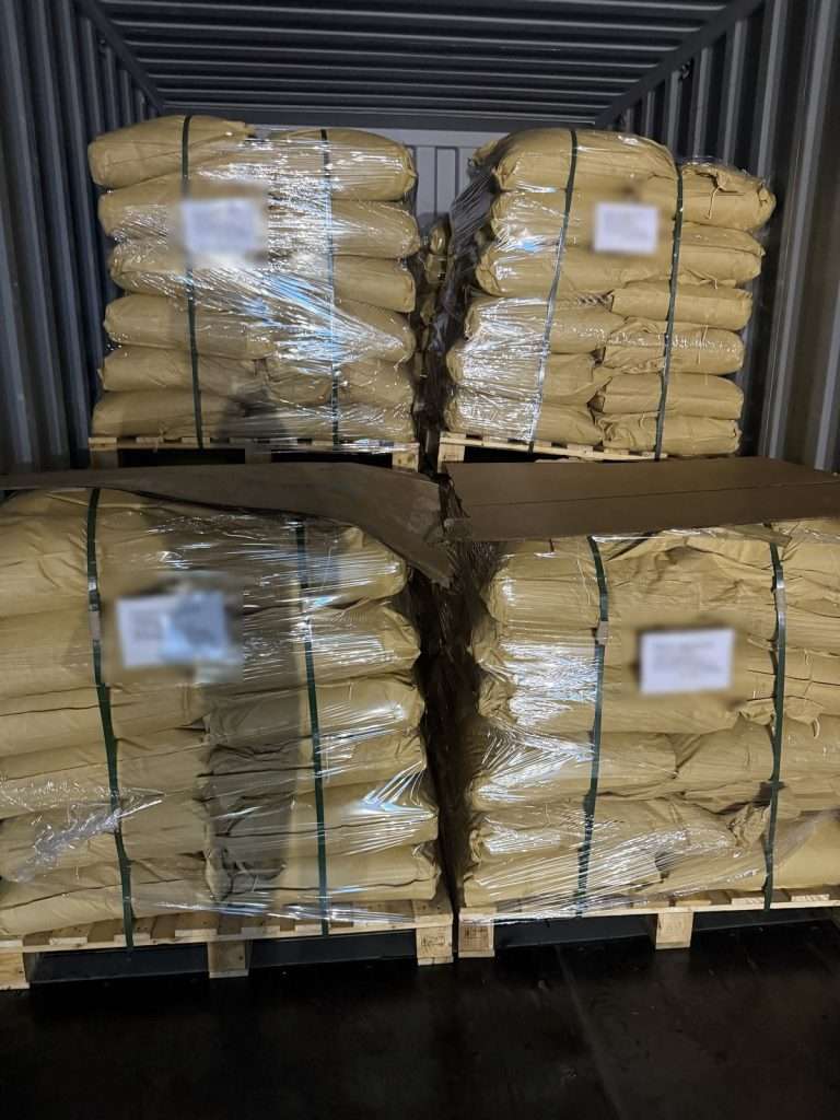 Two tiers of lignosulfonate pallets loaded in a container